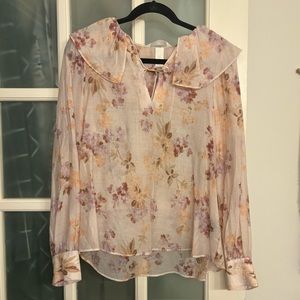 Floral blush blouse with ruffle detail